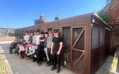 Construction Craft students in front of the animal pens they built at the Arbroath Campus